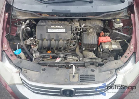 2011 Honda Insight z USA, uszkodzony, nr VIN JHMZE2H38BS011739